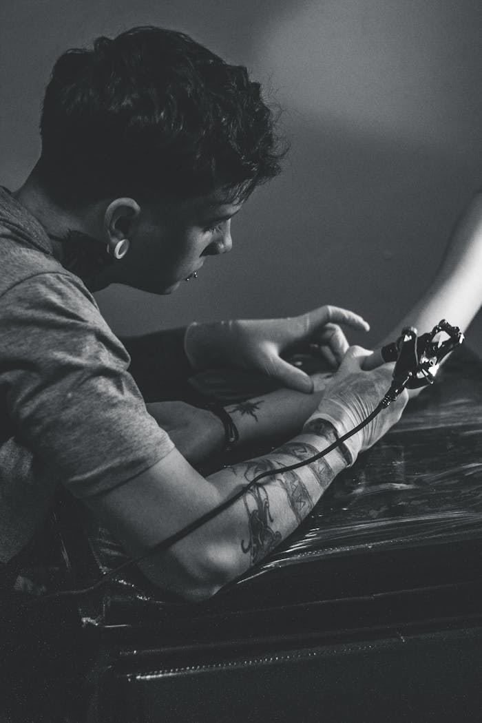 Man Holding Tattoo Machine